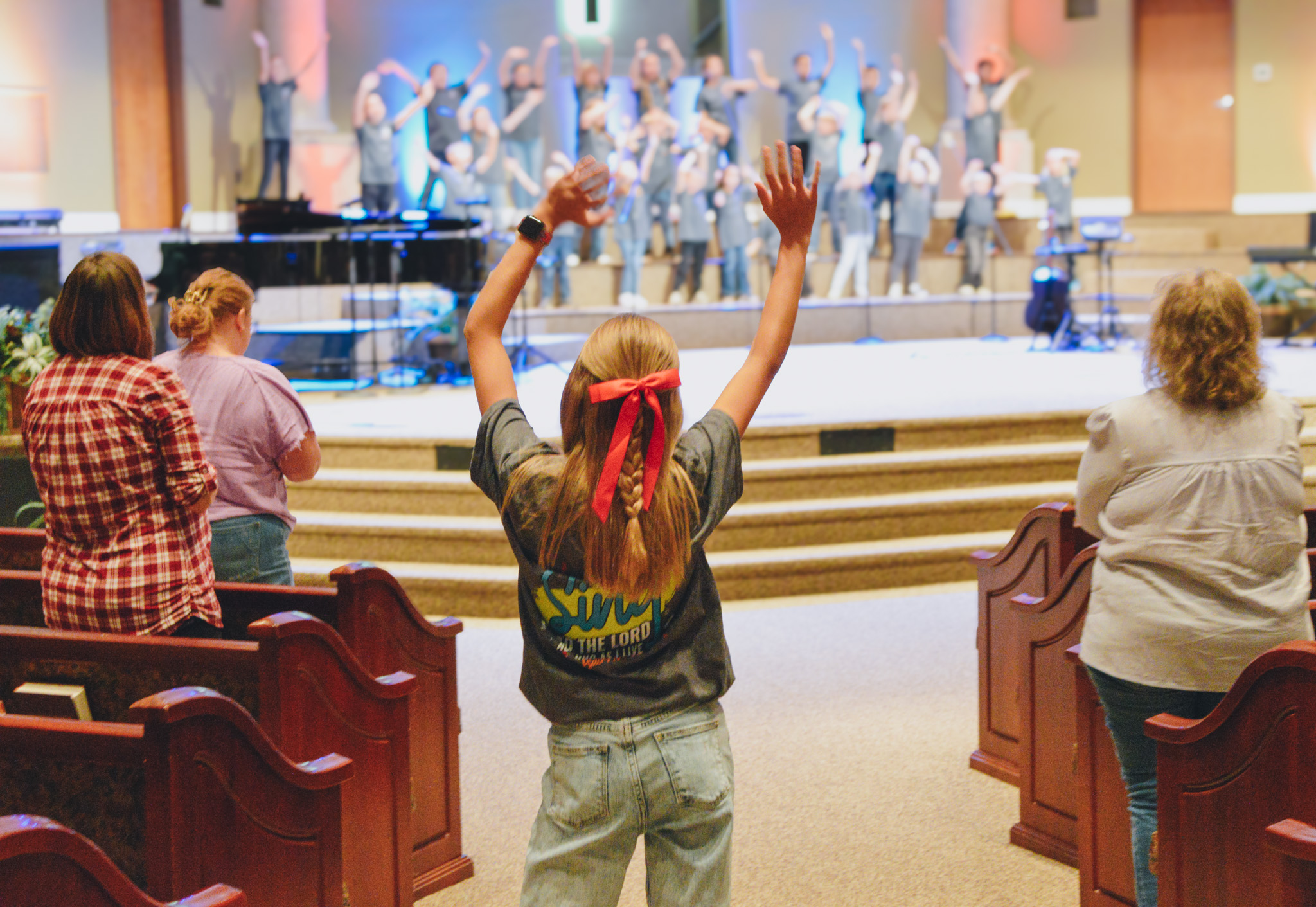 Child worshiping during Kids Choir